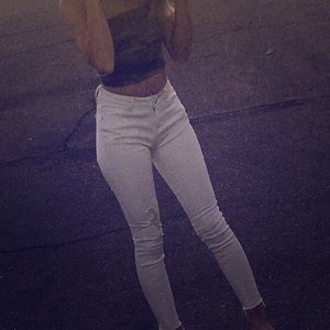 Green camouflage strapless shirt and white jeans